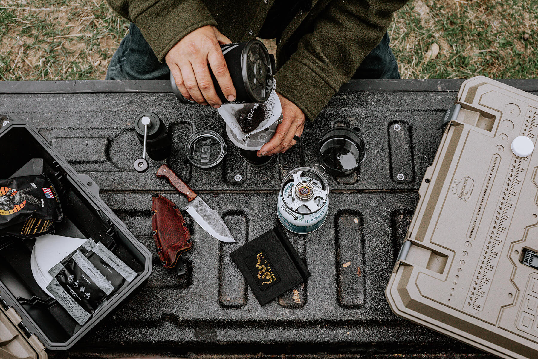 Lucas O'Hara brewing coffee on the tailgate of his truck