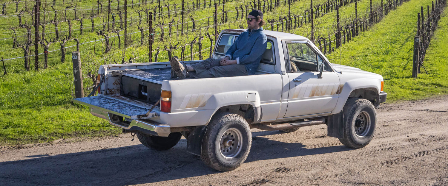 Brad Leone lounging in the back of his truck on top of his DECKED Drawer System.