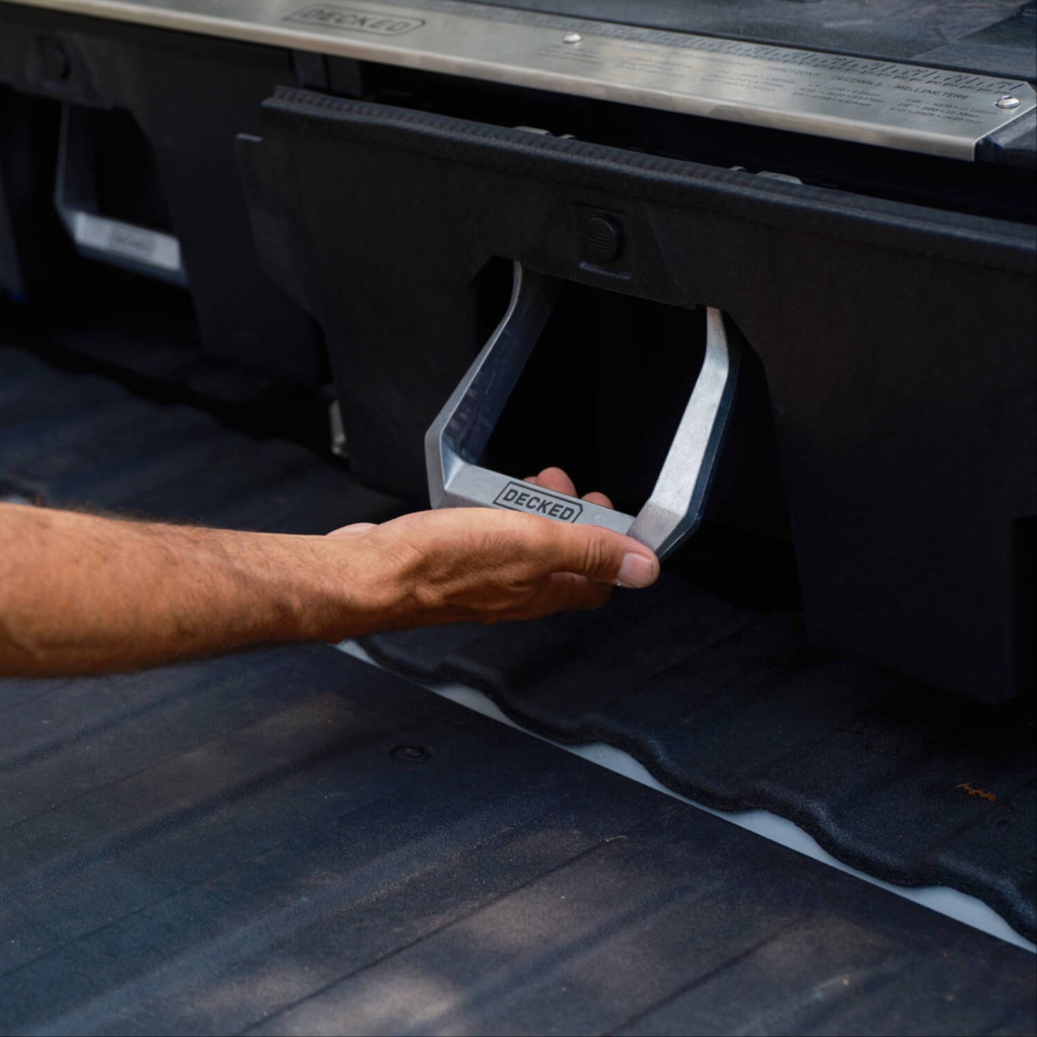 A person pulling the Drawer System handle to open the drawer.