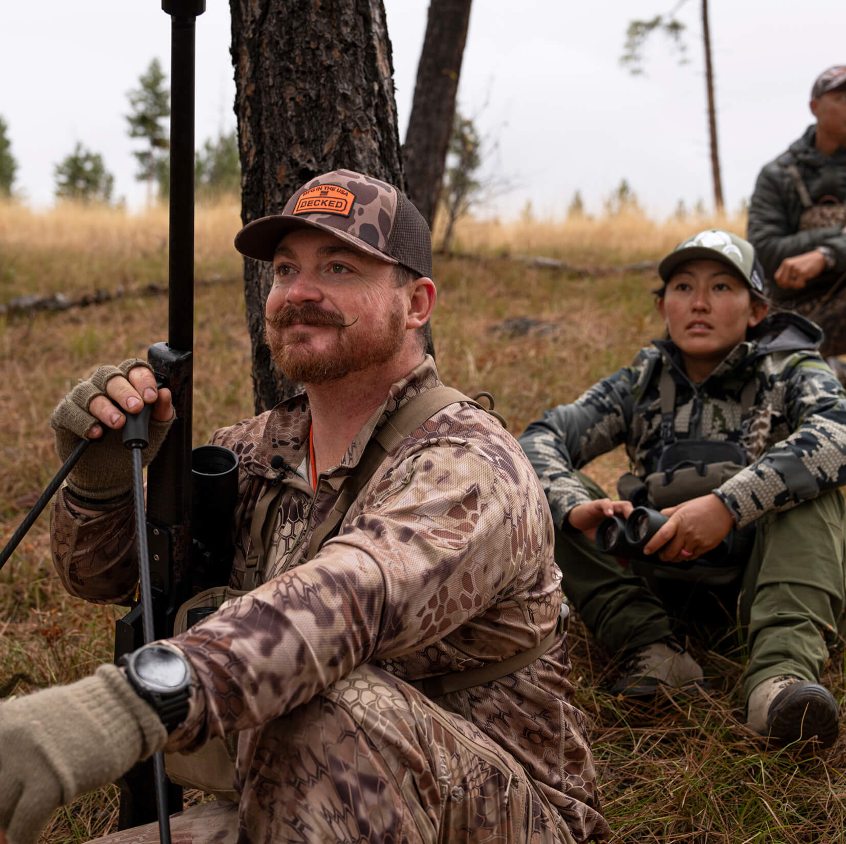 Why is James Nash smiling, and what is he looking at off-camera? We don’t know. But considering the rifle he’s holding, whatever he’s looking at might want to RUN!