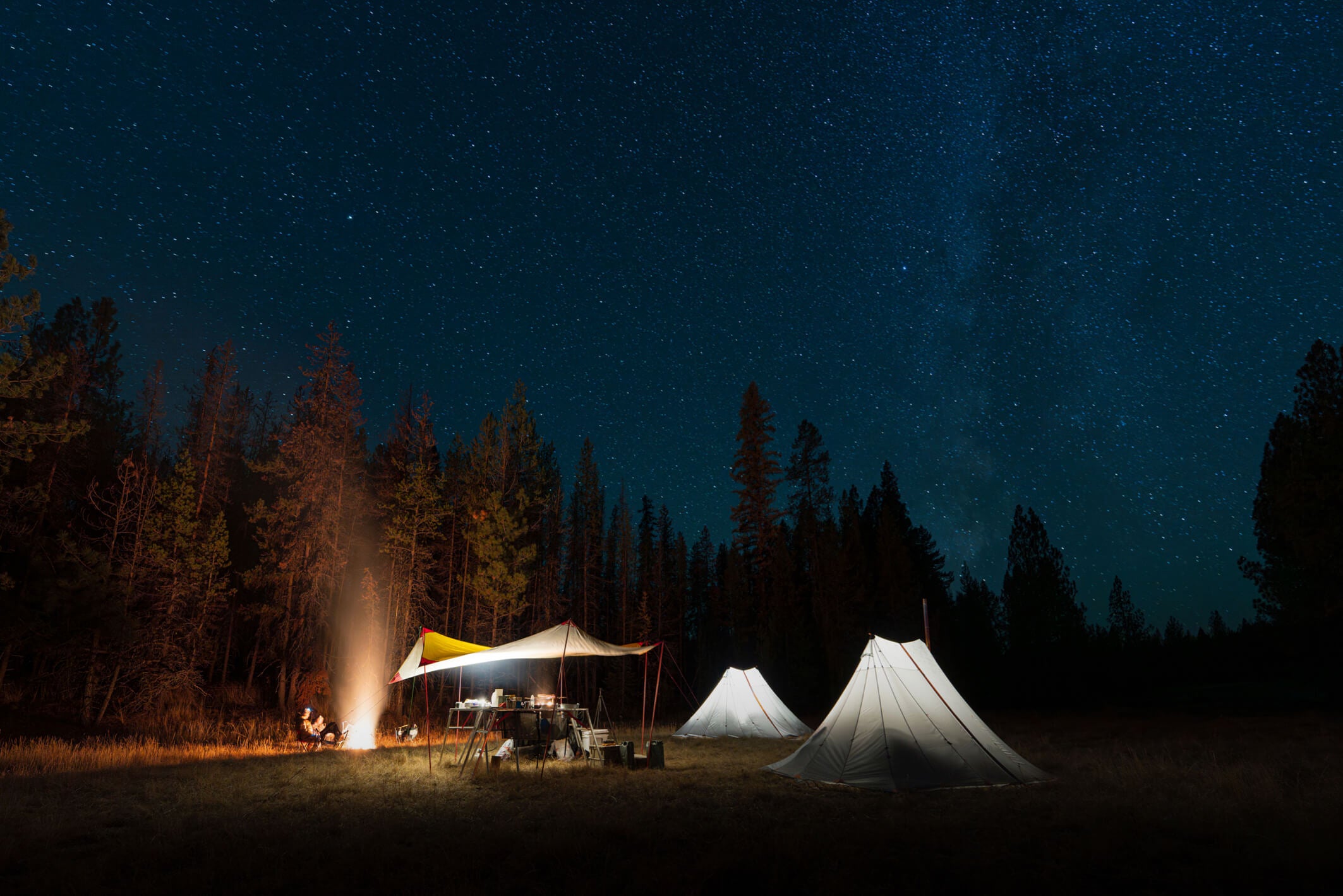 James Nash, at the campfire, regaling his crew with tales of big game hunting and hand-to-hand combat.