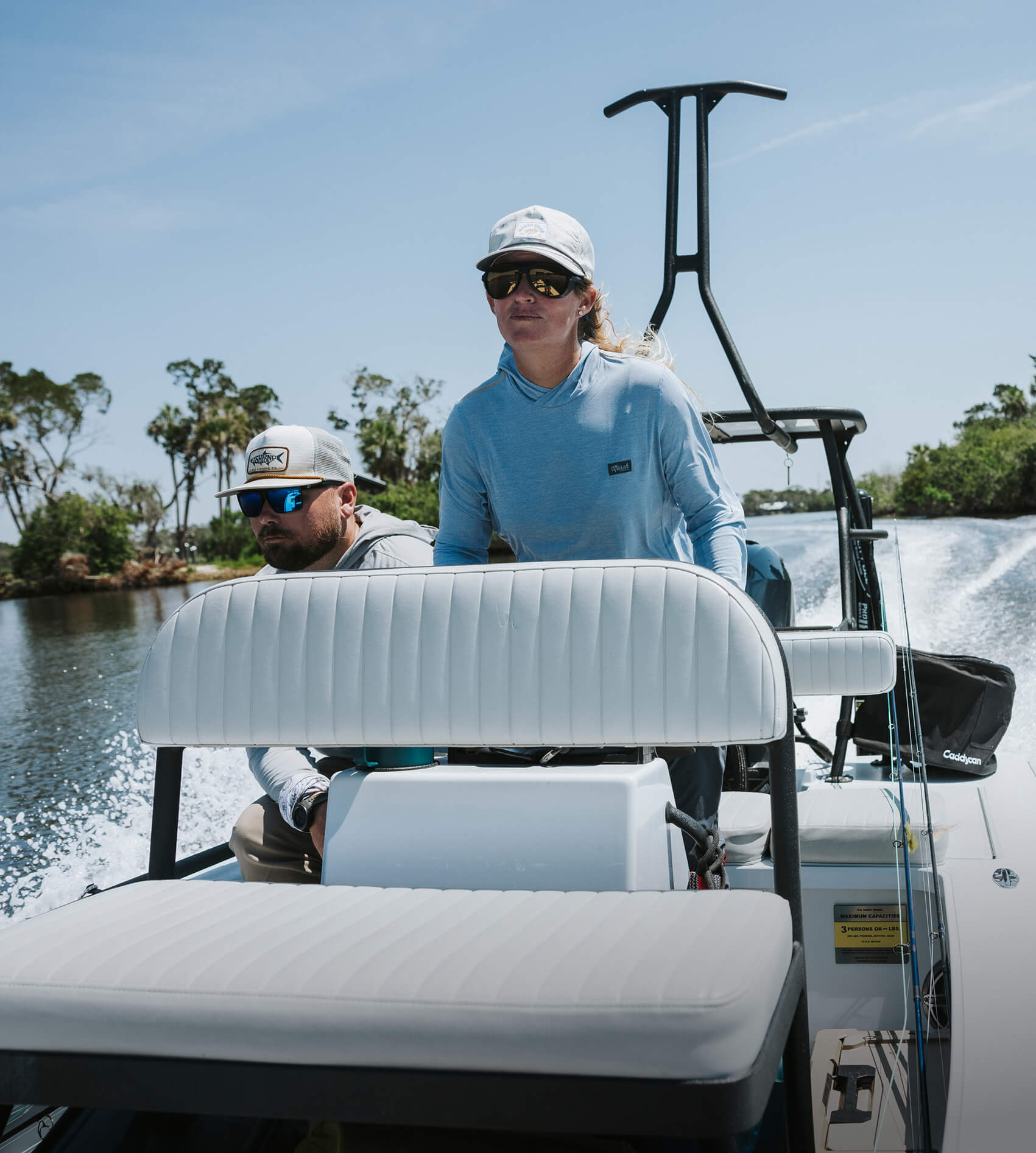 Lacey Kelly looking like a superhero on her boat. Her superpower? She can walk on water. Who’s she protecting? The ocean from too many fish.