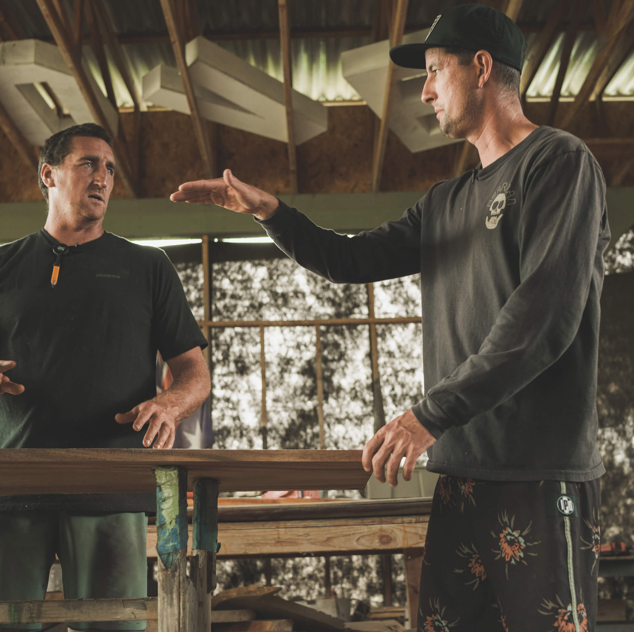 Ben Wilkinson and Danny Bolton in Ben's workshop where they craft a couple of surfboards.