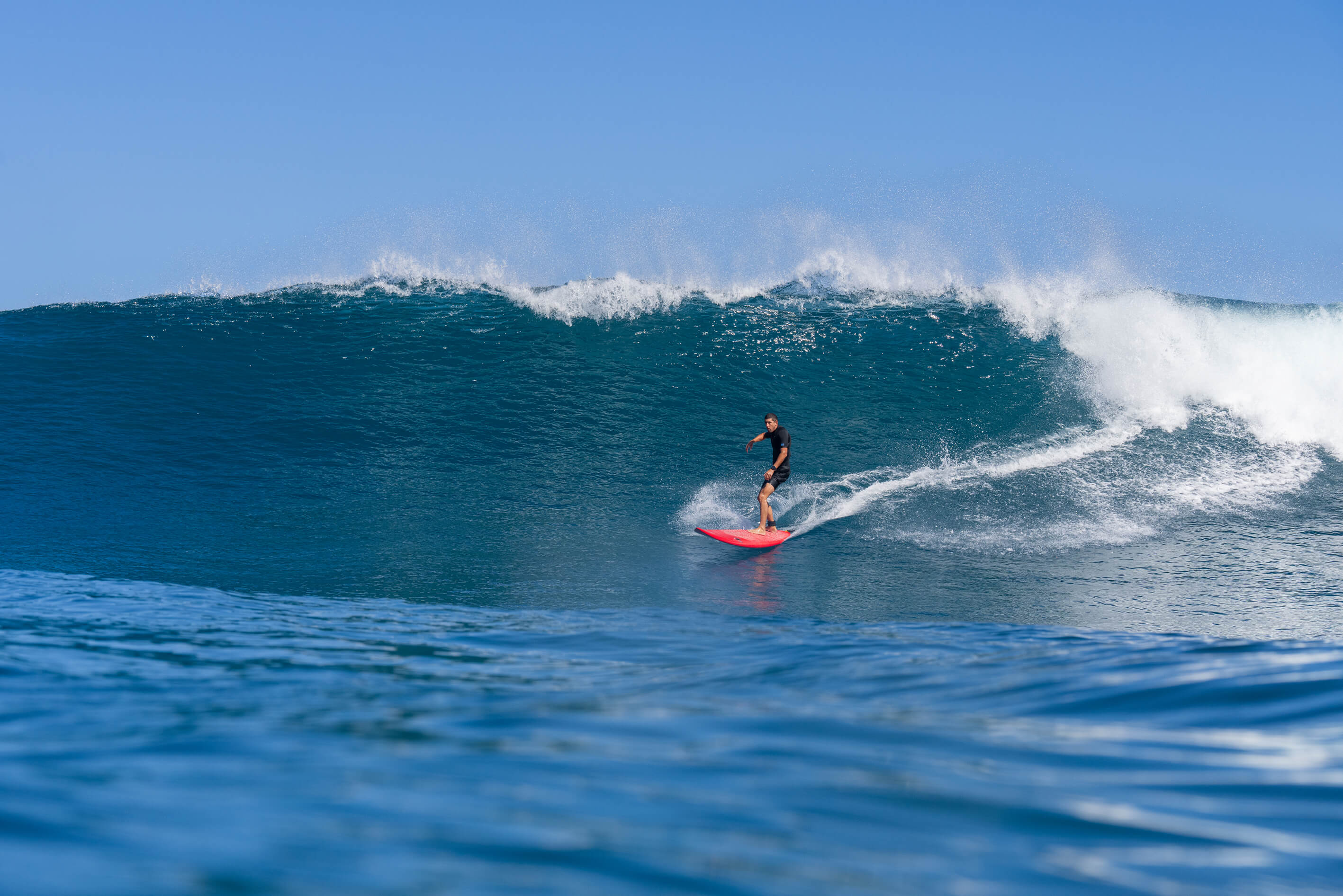 Ben Wilkinson surfing a wave in Hawaii.
