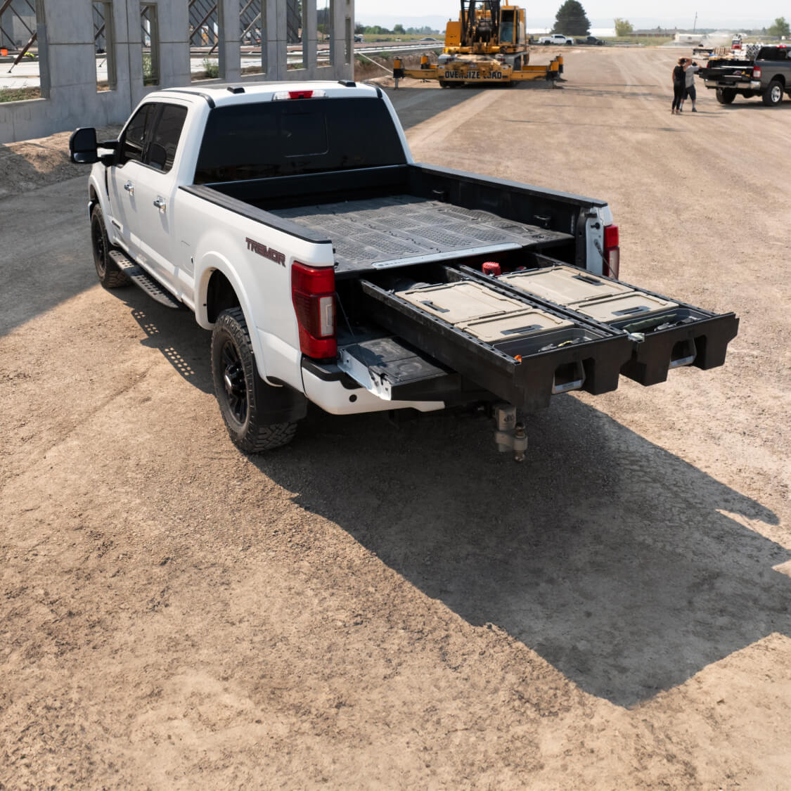 A full-size truck with an open Drawer System in the bed.