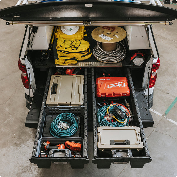 Tools, cables, DECKED cases, and safety gear organized in open Drawer System drawers and a CargoGlide.