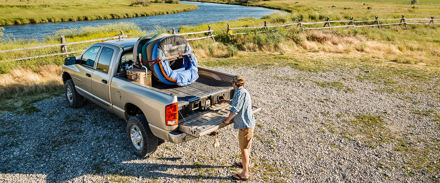 back of truck with a decked drawer system and fishing tubes