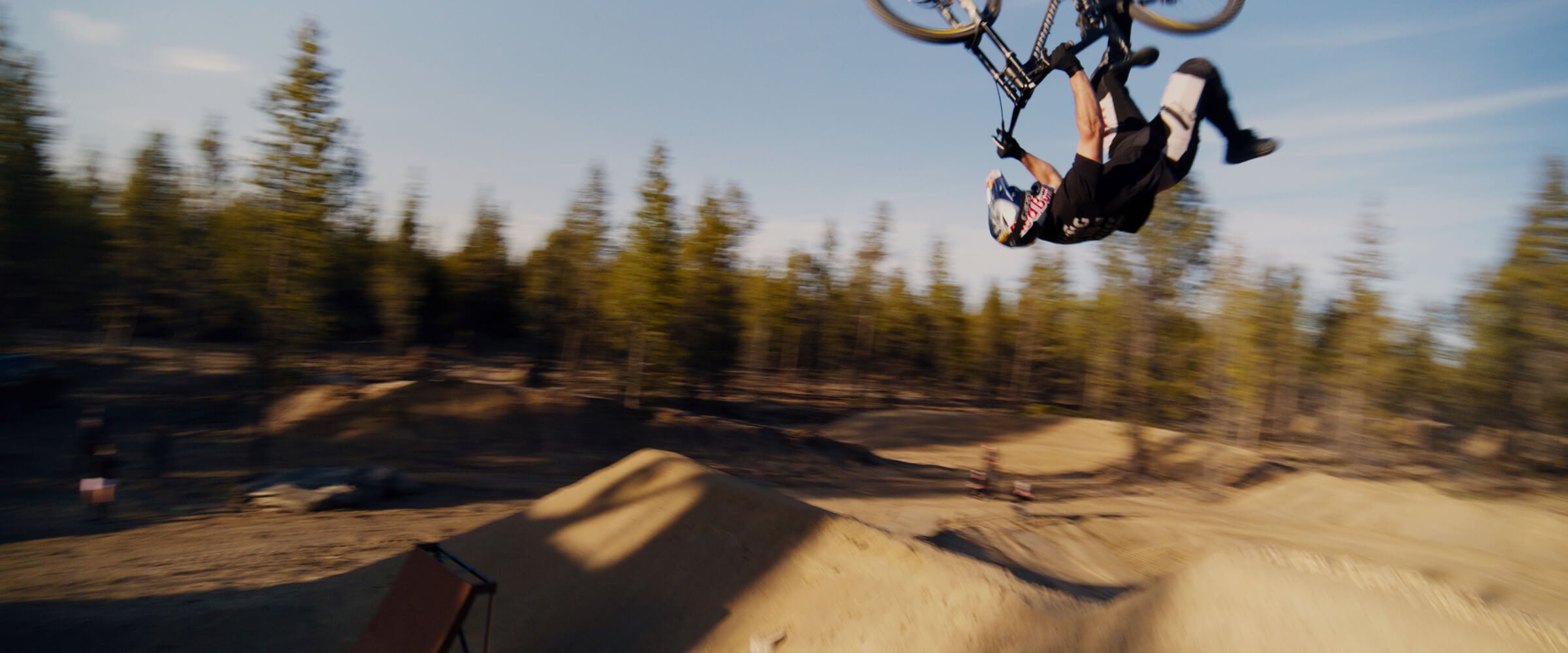 In the air, upside down, with only one foot on the bike? That’s just a typical day on the back yard jumps for Bend, Oregon freerider Carson Storch.