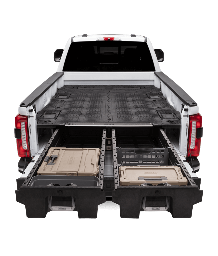 An 8 foot bed truck with the Drawer System and Load Floor that spans the full bed of the truck. The Drawers are fully extended with D-co cases and other Drawer System accessories inside.