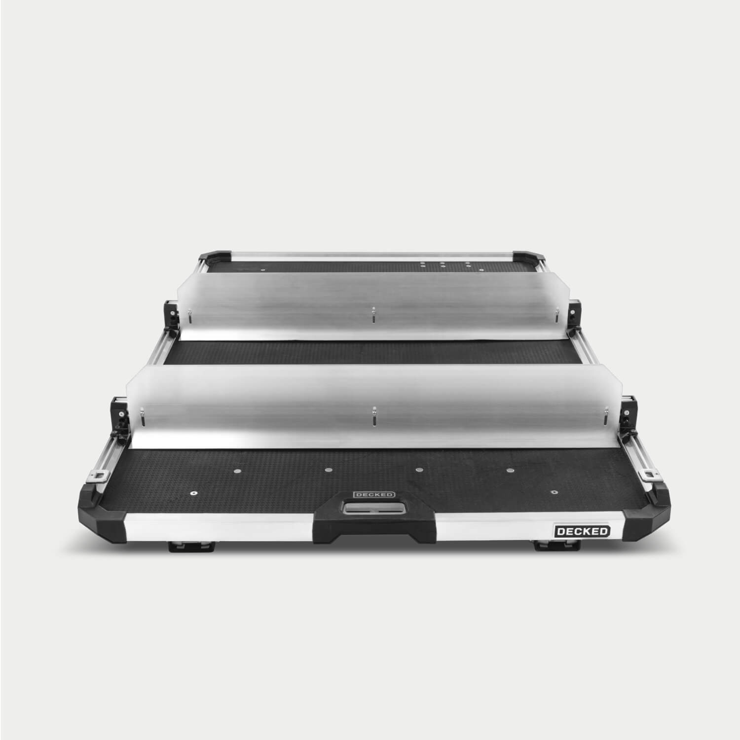 Two Crossbars and accompanying Dividers mounted to the CargoGlide. The Crossbars and Dividers are mounted to the side rails alongside some D-ring tie downs. Both accessories can be mounted anywhere along the length of the CargoGlide. The Dividers add height to your modular storage on the tray.