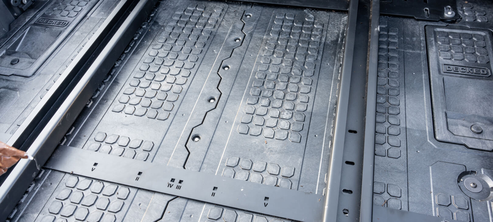 A Mounting Bracket for CargoGlide mounted to a Drawer System.
