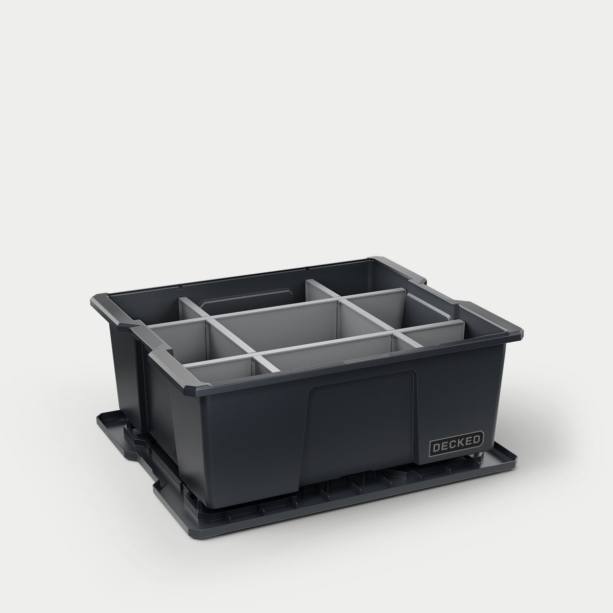 One black DECKED payloader bin with grey POD divider system inside of it.