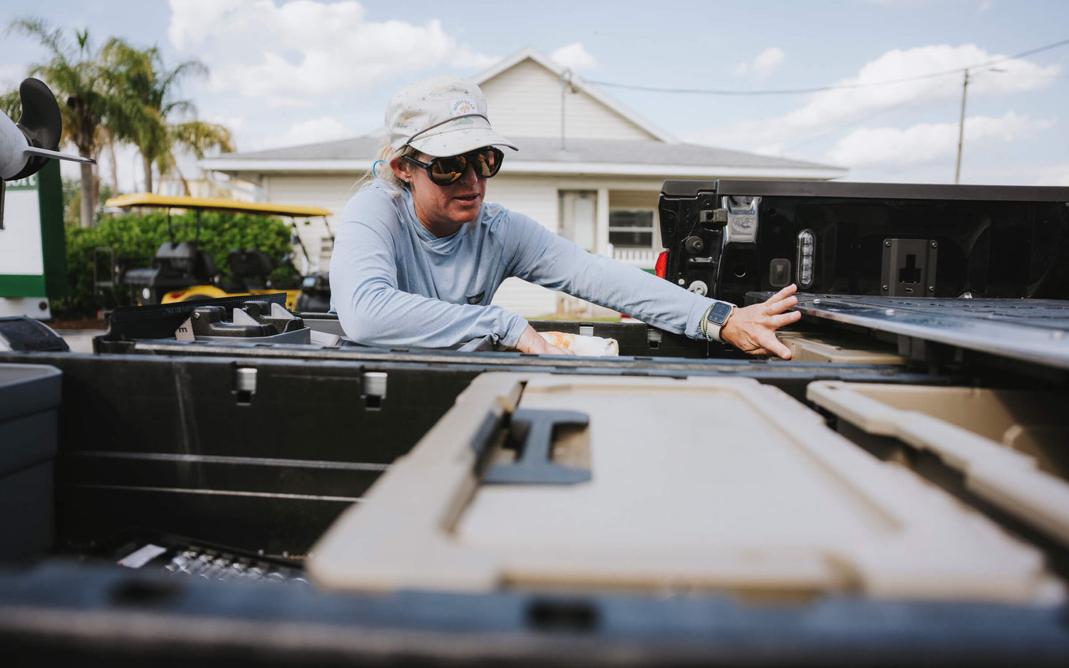 Lacey Kelly organizing the gear in her DECKED Drawer System.