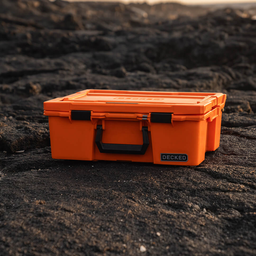 The Blaze Orange Halfrack in stark contrast to the dark lava rock its sitting on.