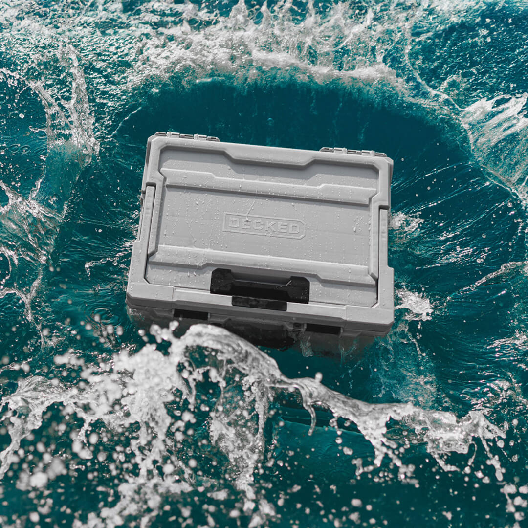 The Cool Gray Halfrack splash-landing into crystal clear, blue water off of the coast of Hawaii.
