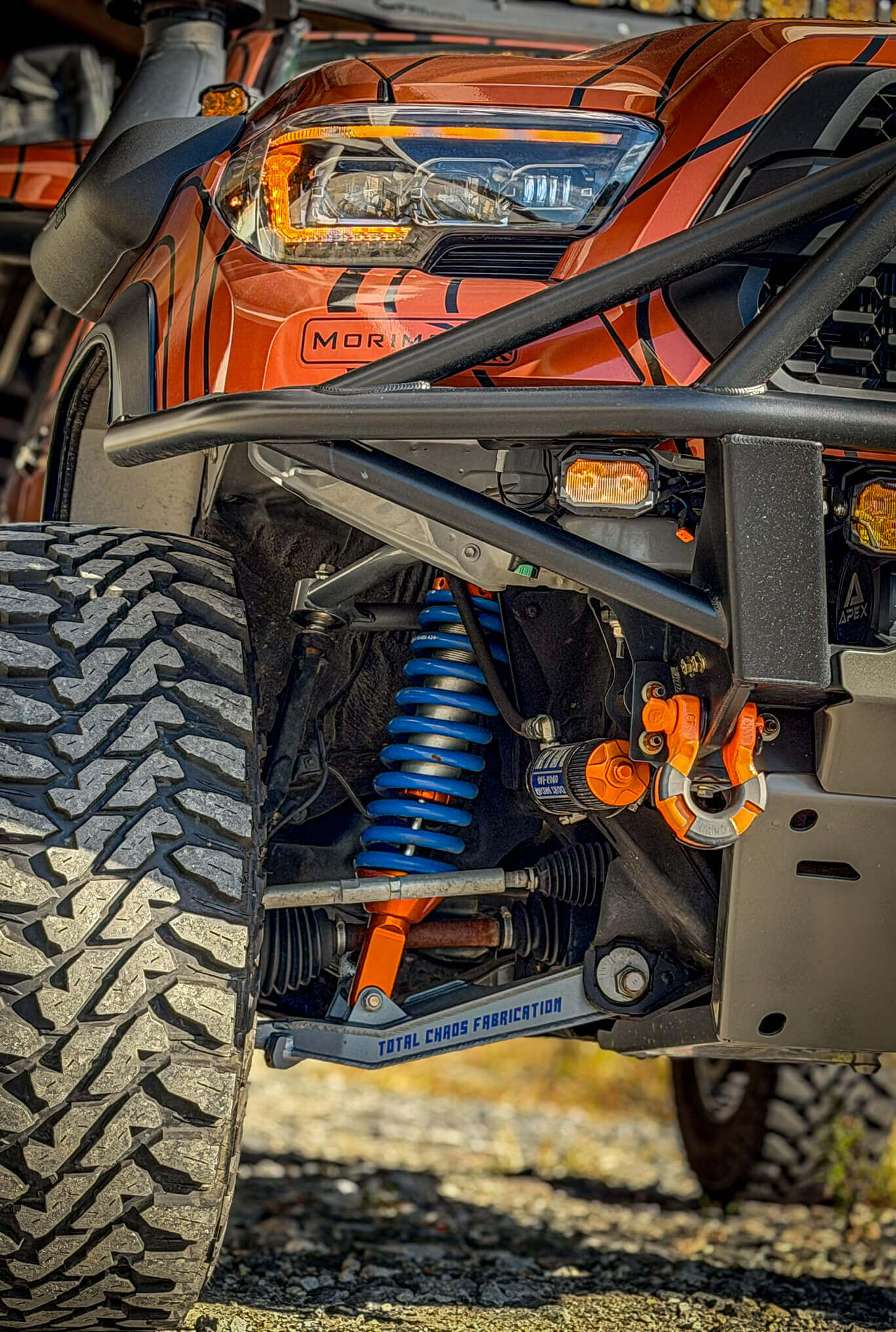 Close-up of an off-road vehicle with suspension components and 'Mor' branding.