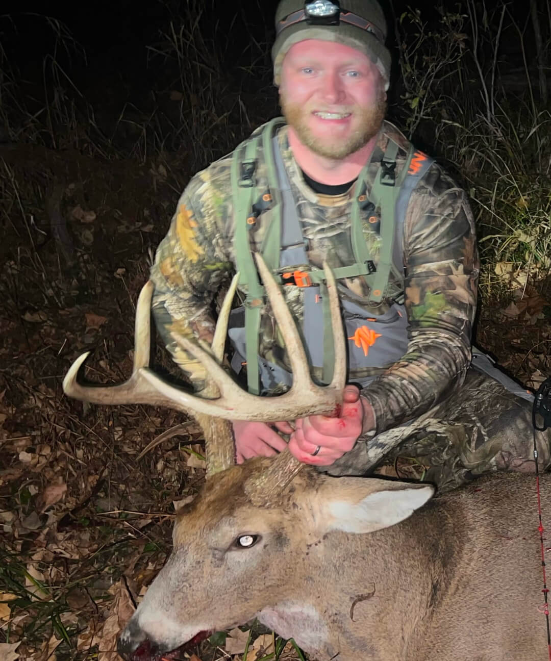 Adam posing with his whitetail buck.