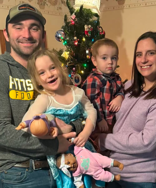 A man and his wife and two kiddos.