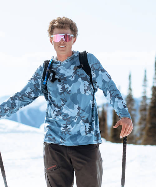 Oskar in Pit Viper sunglasses, skinning up the ski hill.