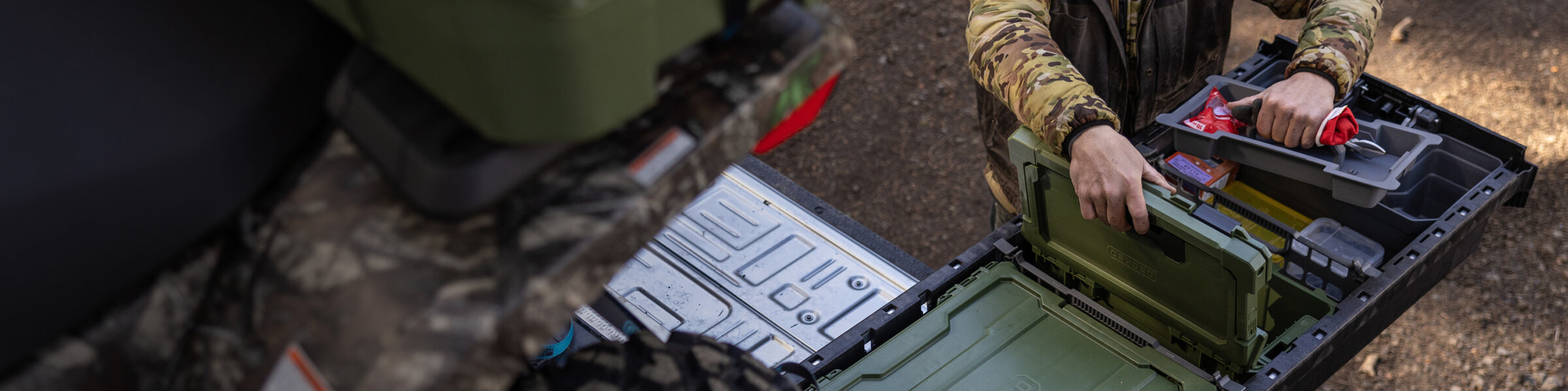 A man retrieving a Cargo Tray out of the Sixer D-co Case stored securely and neatly inside of his Drawer System.