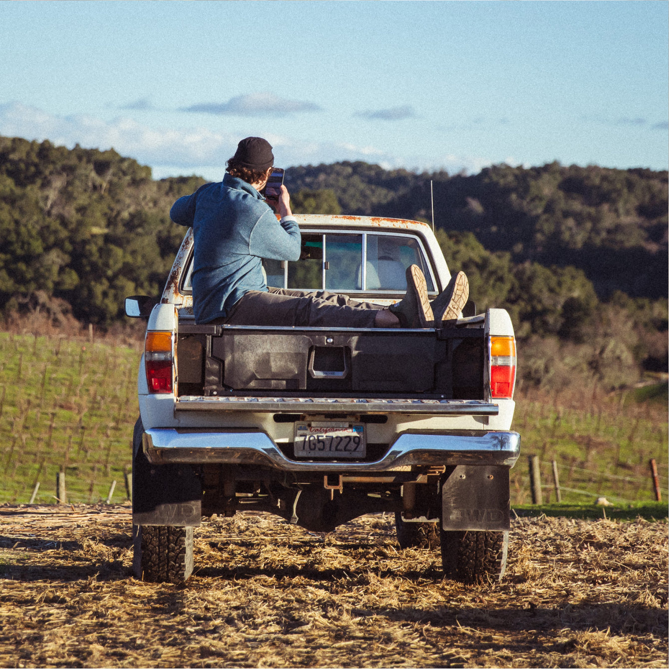 Brad Leone lounging on top of his DECKED Drawer System in the bed of his truck.