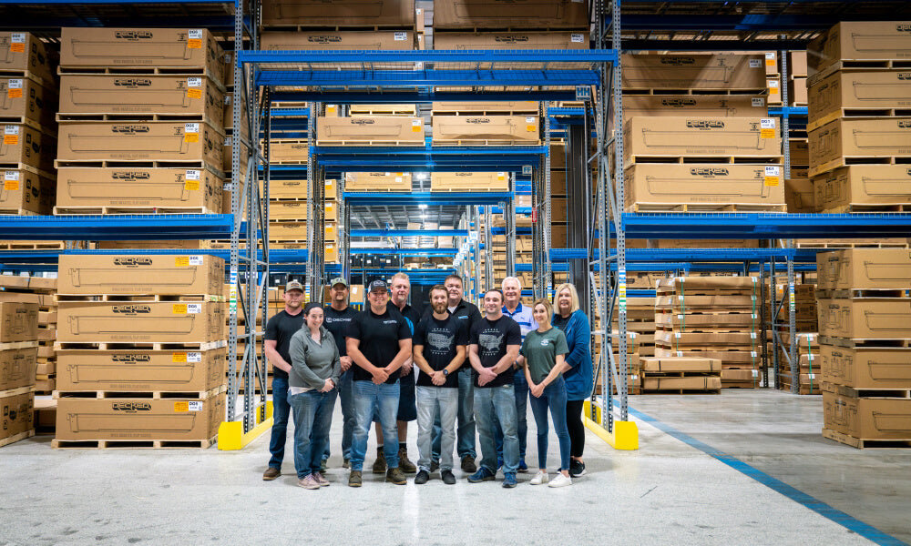 workers standing in the middle of a decked factory