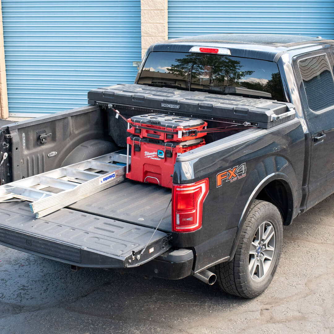 Core Trax being used to secure a case to the DECKED Tool Box in the back of a truck