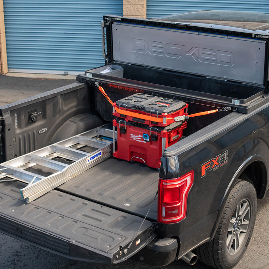Tool Box open in the back of a truck with gear secured to it using Core Trax