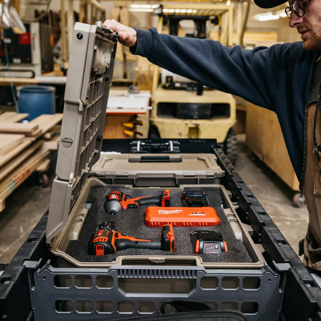 Man opening a Halfrack 32 with power tools organized inside the custom foam