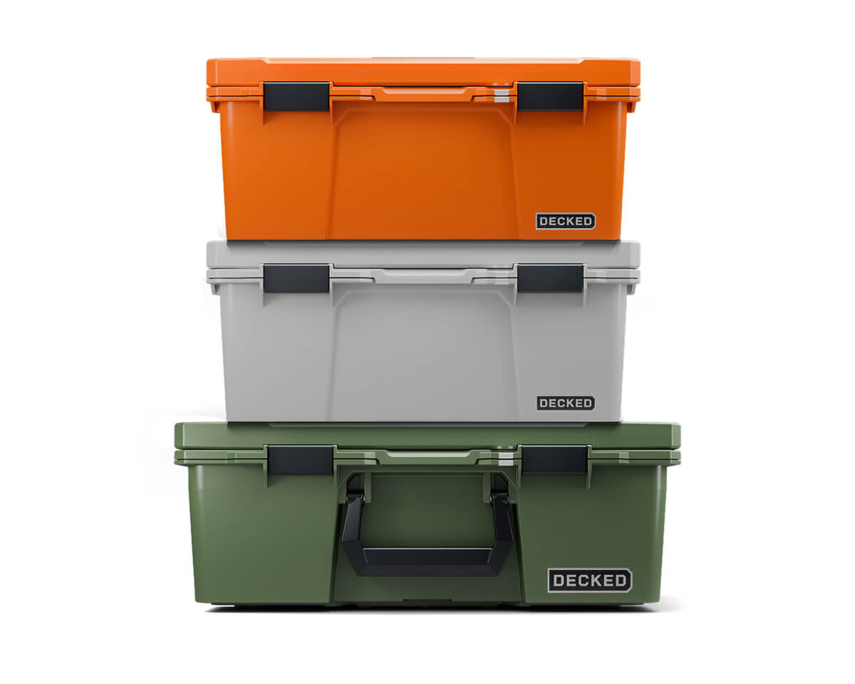 A stack of three D-co Cases in the new colors, Ranger Green, Cool Gray, and Blaze Orange.
