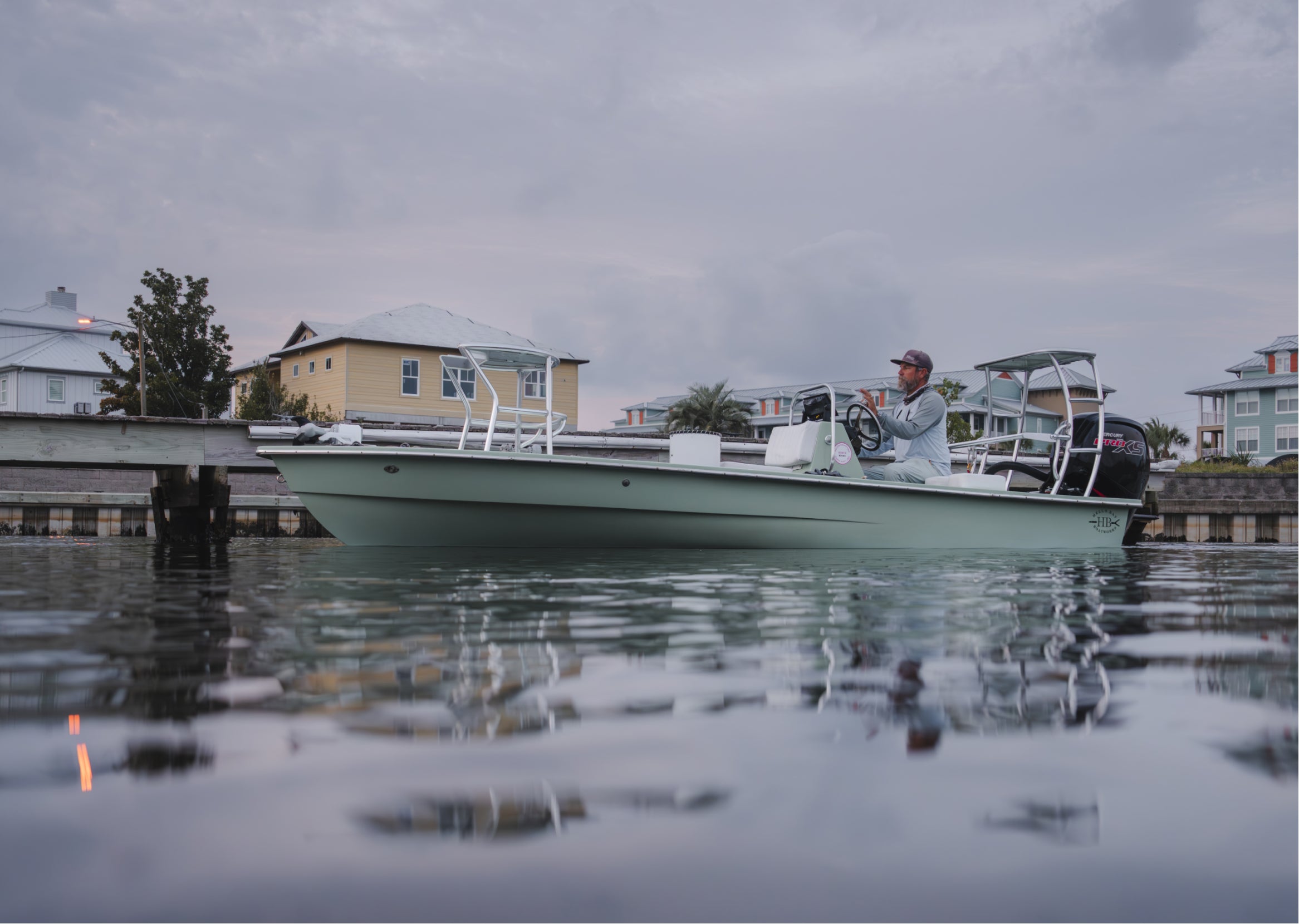 David Mangum in the canals of Florida at the helm of his boat.