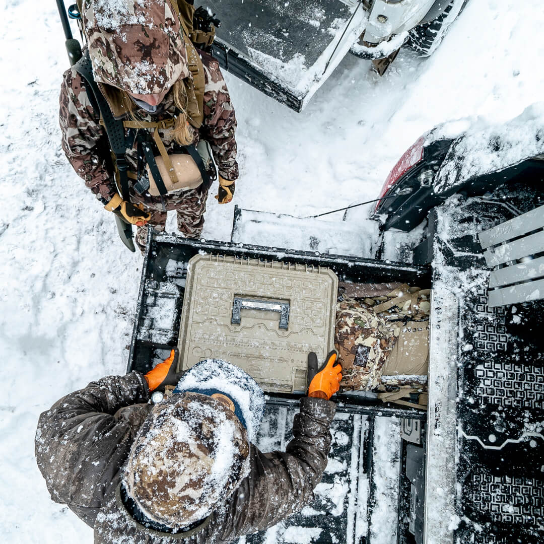 Hunters grabbing a Tan D-Box out of a Drawer System in the snow