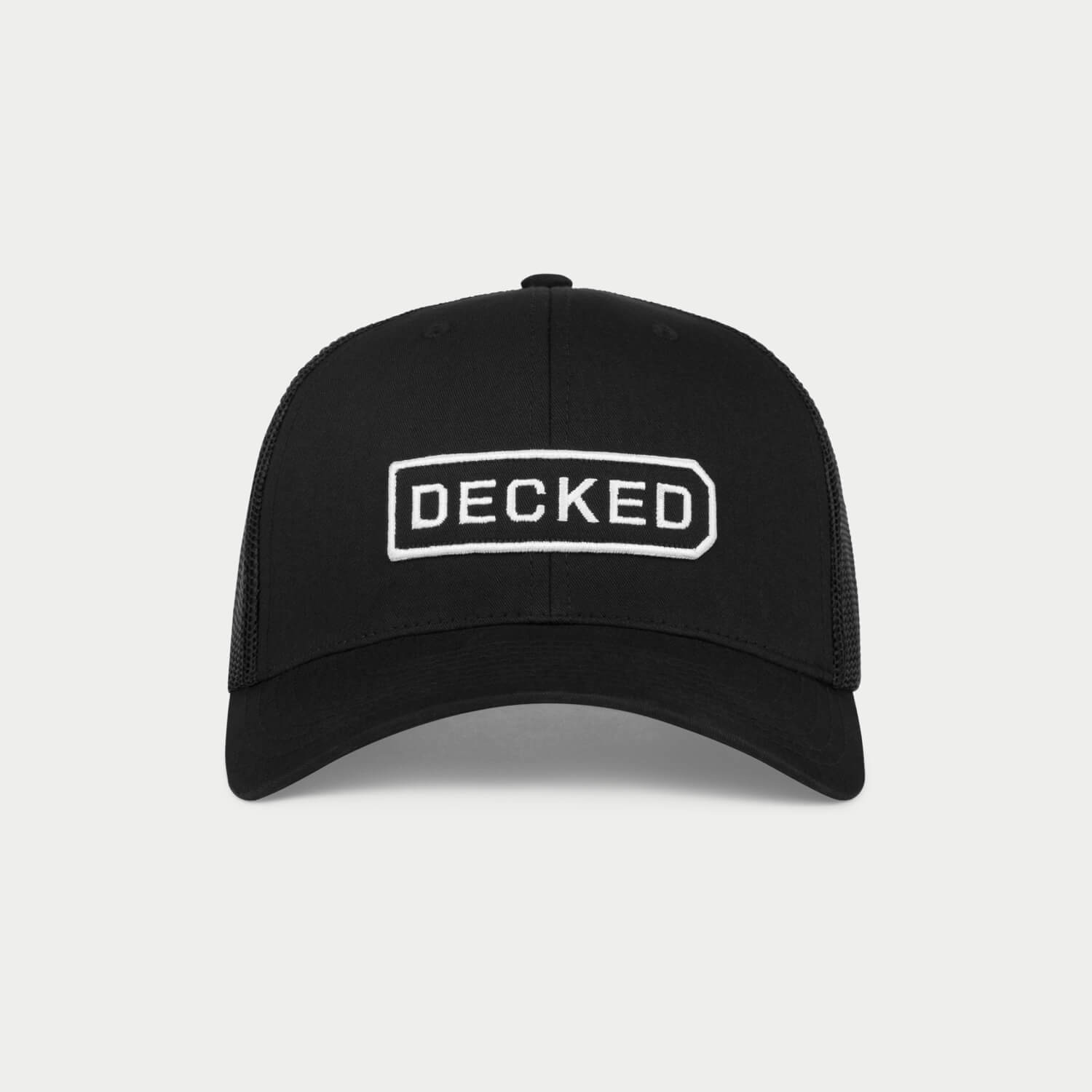 Black cap with 'DECKED' logo on a light gray background