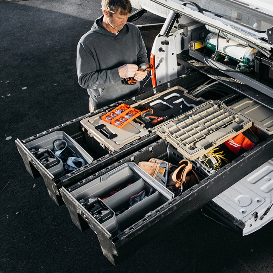 Power tools and other gear stored in a Double drawerganizer at the jobsite