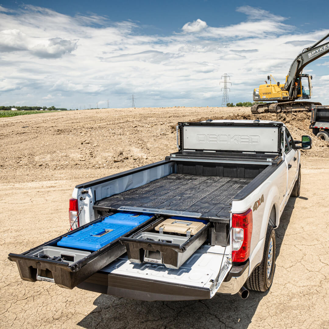 Backside view of a Drawer System installed in a 8 foot truck with a DECKED Tool Box in the cabside gap