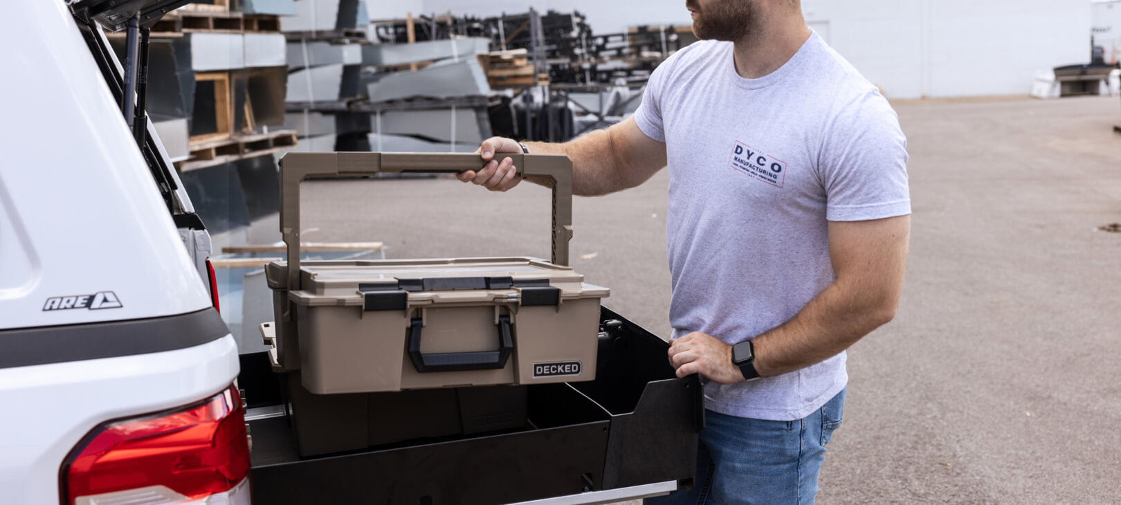 A man putting a Halfrack into a Maverick Drawer System.