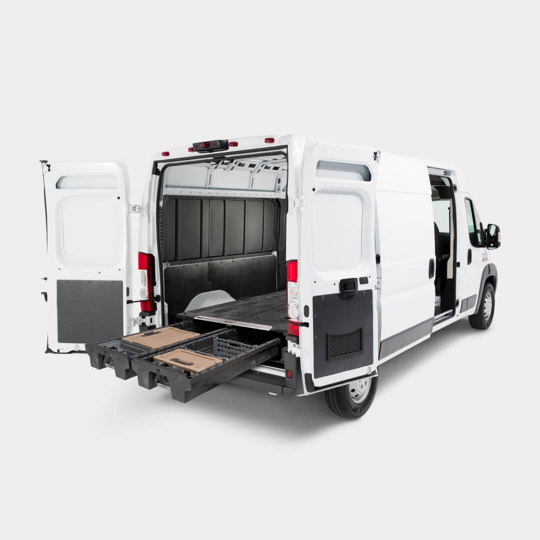 Angled image of a van with a Drawer System for cargo vans inside with drawers fully extended.