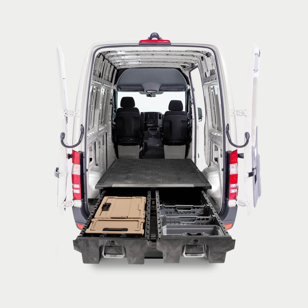 Straight-on image of a van with a Drawer System for cargo vans inside with drawers fully extended.