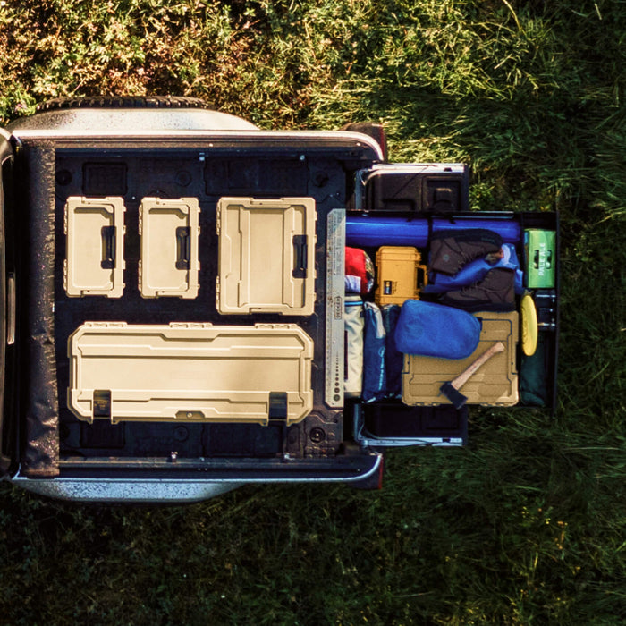 top down view of d-co cases on the back of a truck and a midsize drawer system open