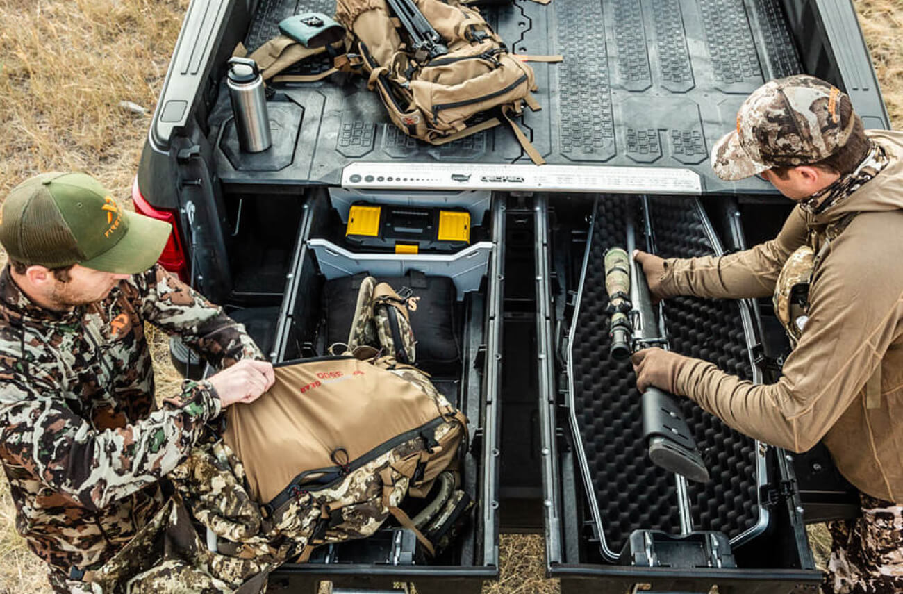 hunters storing their rifle in a decked drawer system