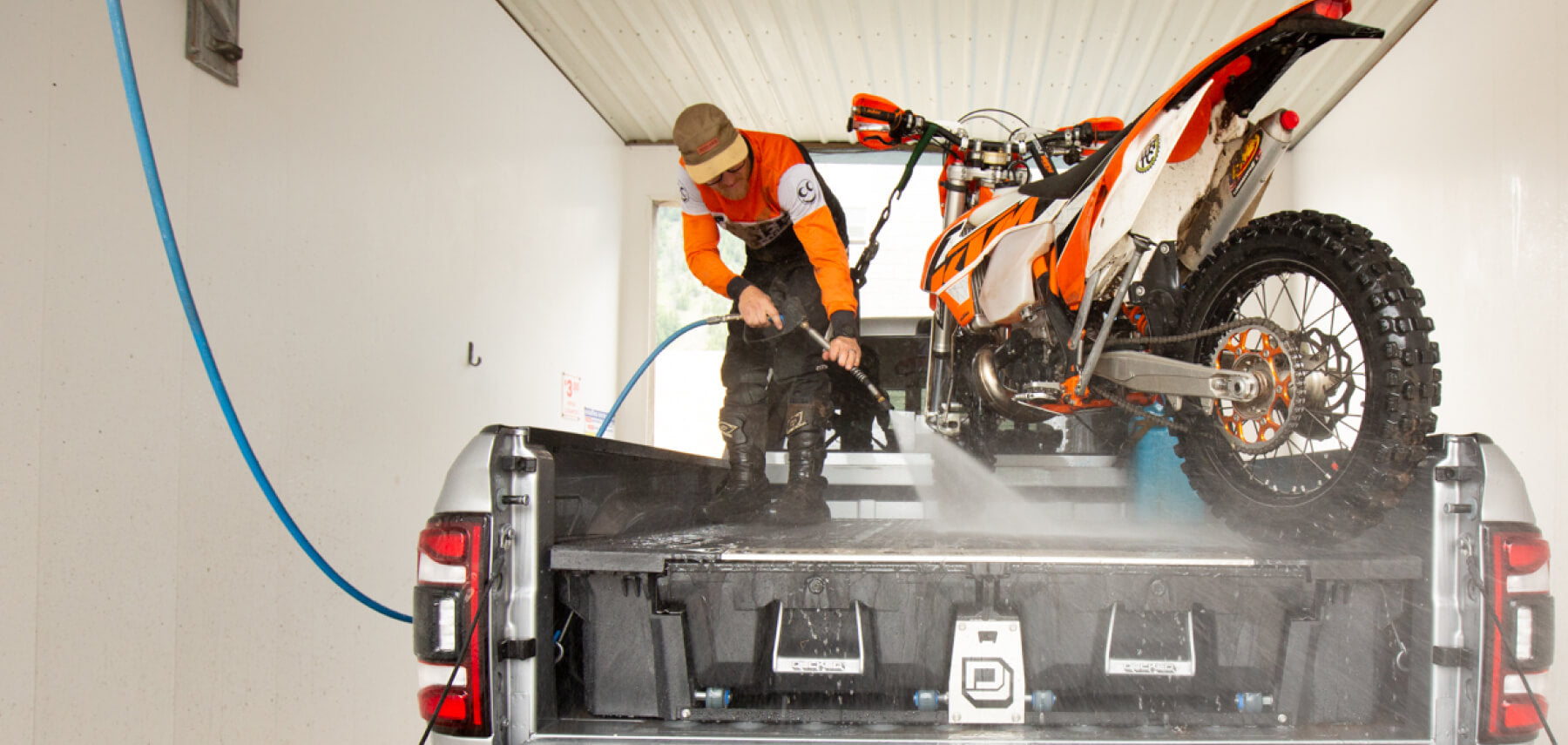Dirt bike on the back of a drawer system at a car wash