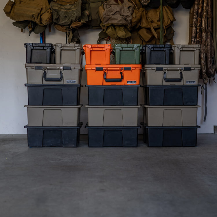 DECKED D-CO cases stacked in a garage.