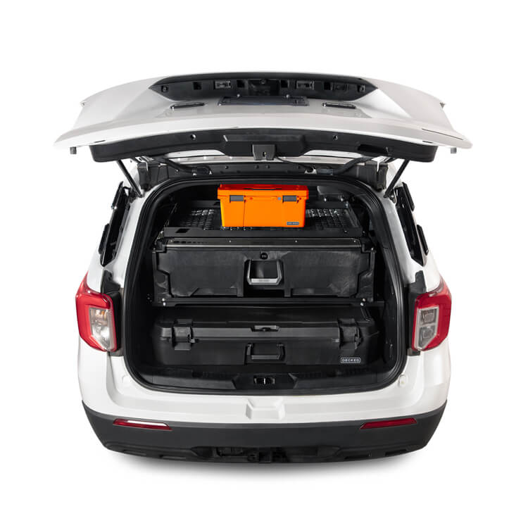Open car trunk with black and orange storage cases on a white background