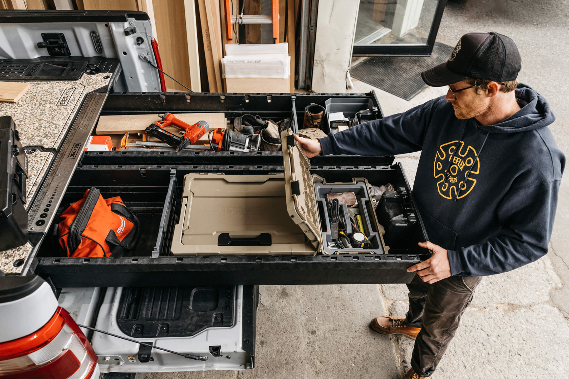 Man opening a Sixer in his open Drawer System