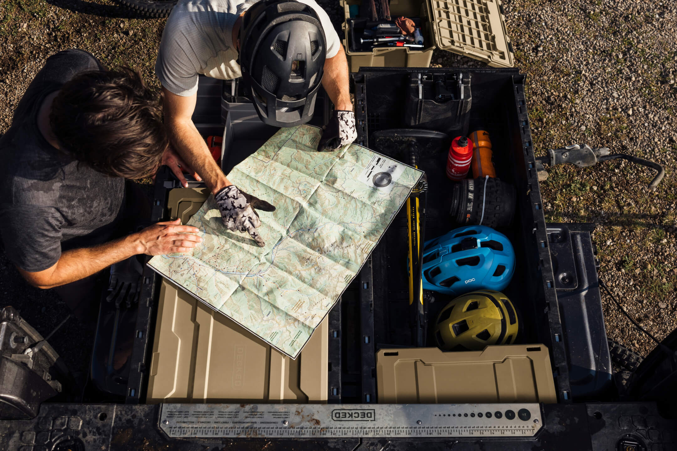 Two people looking at a map on the back of a drawer system