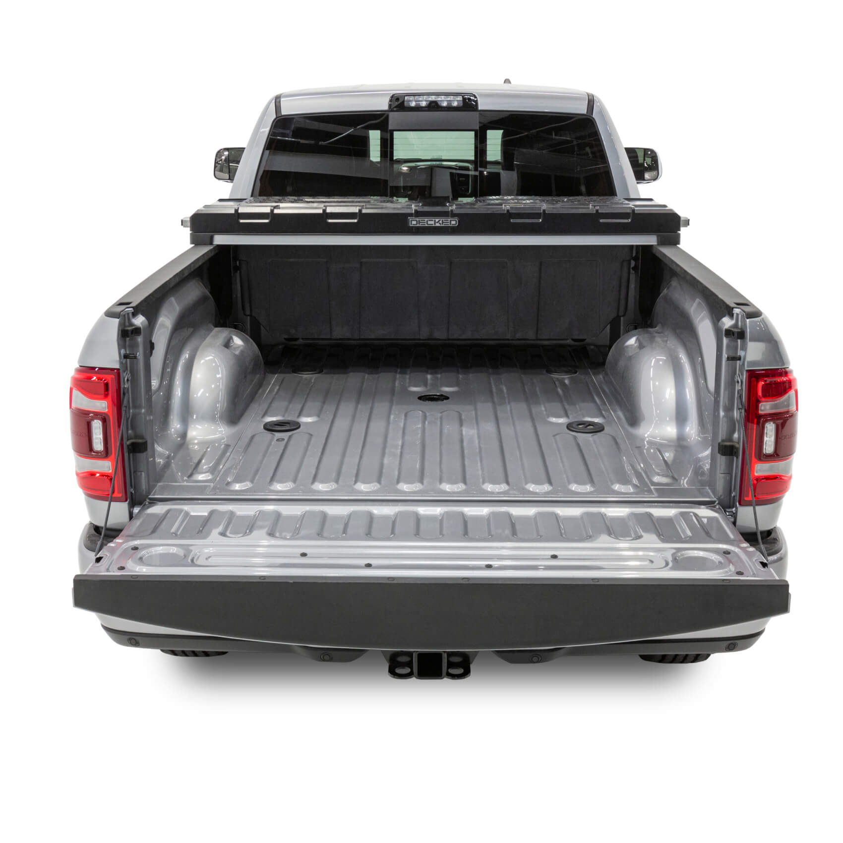 Studio image of a DECKED truck bed tool box in the back of a truck