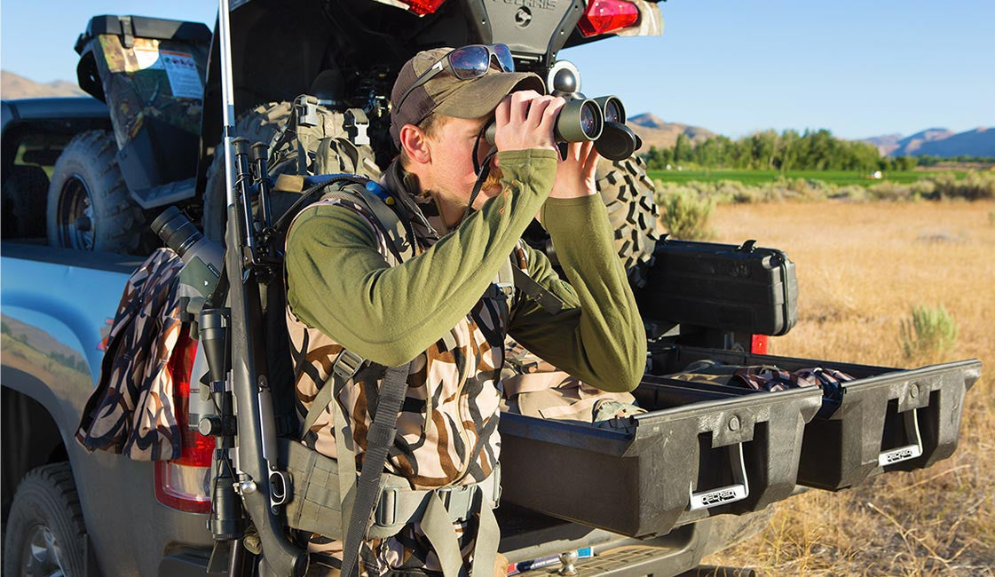hunter looking through his binoculars
