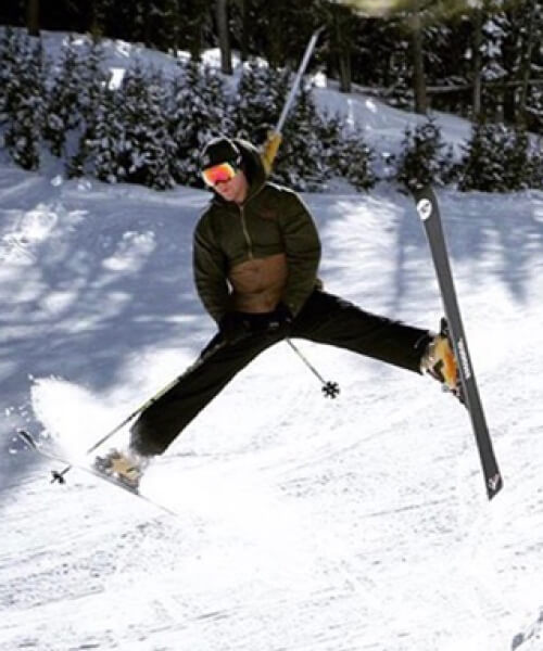 Man doing a trick while skiing
