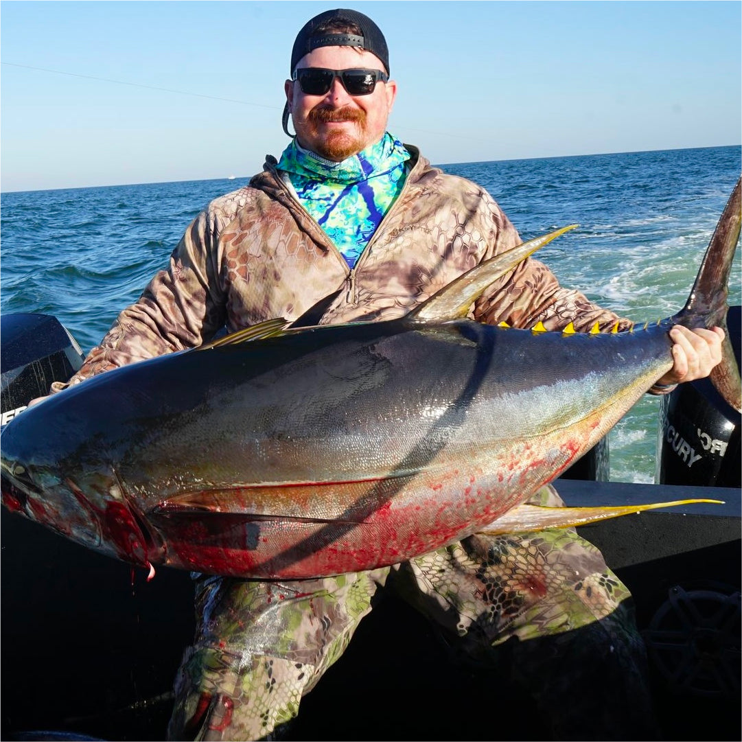 James Nash holding a yellowfin tuna.