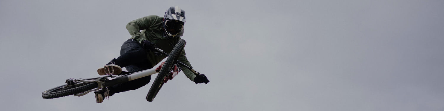 Kyle Strait in race gear, mid air on his bike.